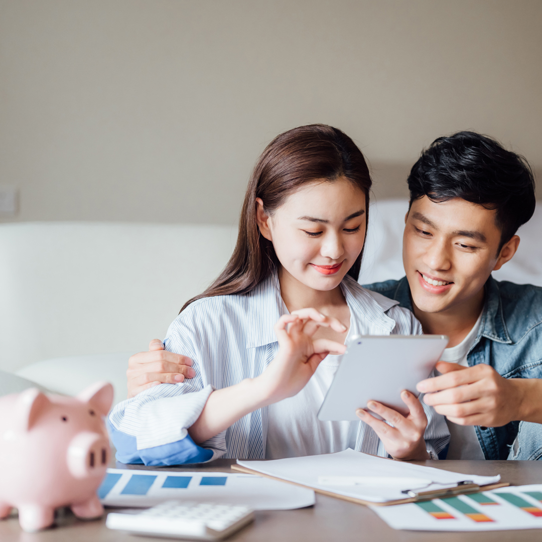 Young couple with piece of paper